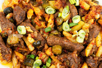 Beef tatarian goulash or azu, food background.