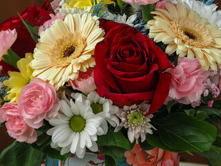 colorful different types of flowers in a bouquet, daisy, carnation, dahlia, rose, gypsophila,...