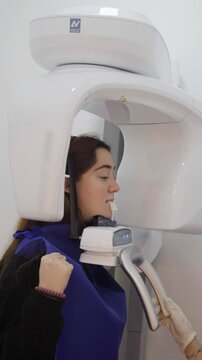 Patient undergoing dental cone beam computed tomography