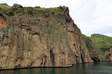 Cliff face on the coast of Heimaey island- Vestmannaeyjar- Westman Islands-Iceland   