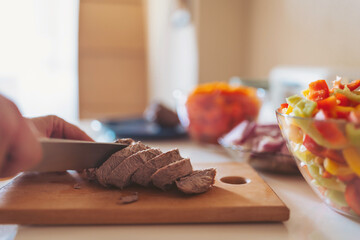 Preparing a delicious meal with fresh ingredients in a cozy kitchen during afternoon light