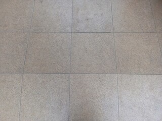 Fototapeta premium Seamless Pattern of Textured Light Grey Floor Tiles with Grout