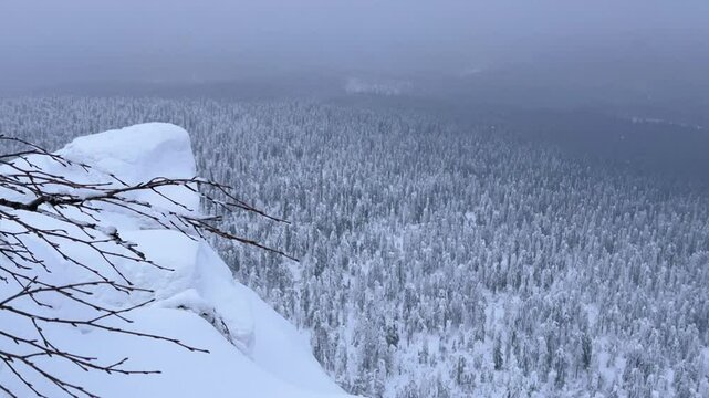 View of the white rocks and the winter forest on Mount Polyud. Lappish spruces on Mount Polyud in the Perm region in winter. In winter, there is a lot of snow and frost on the trees in the Urals. 4К	
