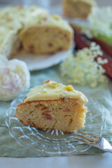 rhubarb vanilla sponge cake with elderflower on a table