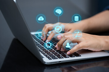Hands typing on a laptop with connected data icons illustrating cloud computing artificial intelligence and information technology concepts
