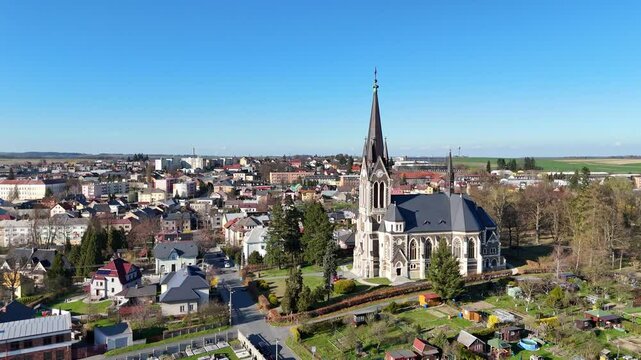 Aerial establishing orbit Vitkov Church, Czech Republic, showing dense rooftops and vibrant skyline