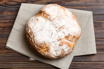 Fresh homemade crisp round bread on napkin, top view. Healthy unleavened bread. French bread. Top view Bakery products