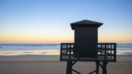 Lifeguard tower on the beach in Sidi Ifni during sunset overlooking the Atlantic Ocean