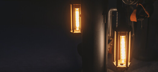 vintage incandescent lamps on black background banner copyspace