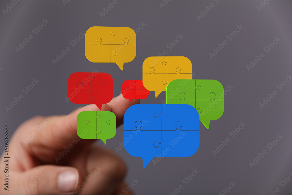 Poster abstract image of puzzle pieces forming speech bubbles, symbolizing communication and collaboration.
