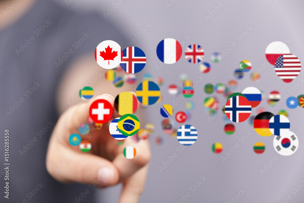 Aufkleber person interacts with a digital display showing various national flags, representing global connecti