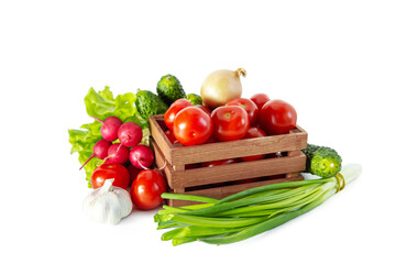 Mix of different vegetables in a wooden box. Isolated on white background.