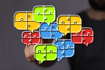 Colorful puzzle pieces in speech bubbles illustrate teamwork, communication, and problem-solving.