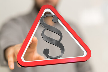 Hand reaching for a red triangle warning sign with a paragraph symbol.  Legal concept image.