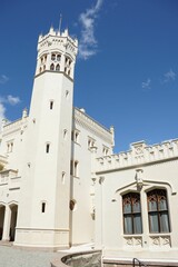 Obraz premium Historic white castle under clear blue sky.