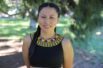 Native American woman with traditional colorful outfit 