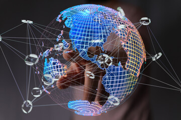 Hand interacts with a digital globe, illustrating global network, internet, and digital connection.