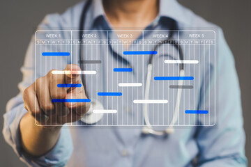 Doctor managing digital weekly calendar, concept of medical scheduling and hospital planning.