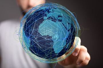 High-tech image of a man interacting with a digital globe, showcasing global networking and...