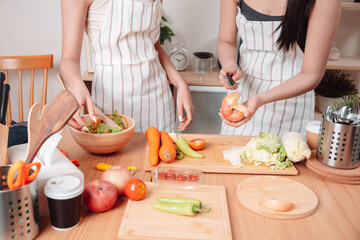 Young Women Asian Food Cooking Preparation Salad Vegetable Kitchen Lifestyle Healthy Eating, Joyful Moments of Healthy Meal Making and Togetherness in a Cozy Home Kitchen Full of Freshness and Smiles