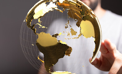 Golden globe in hands, representing international business, global network, and worldwide...