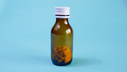 brown glass bottle for supplement product isolated on white background with clipping path