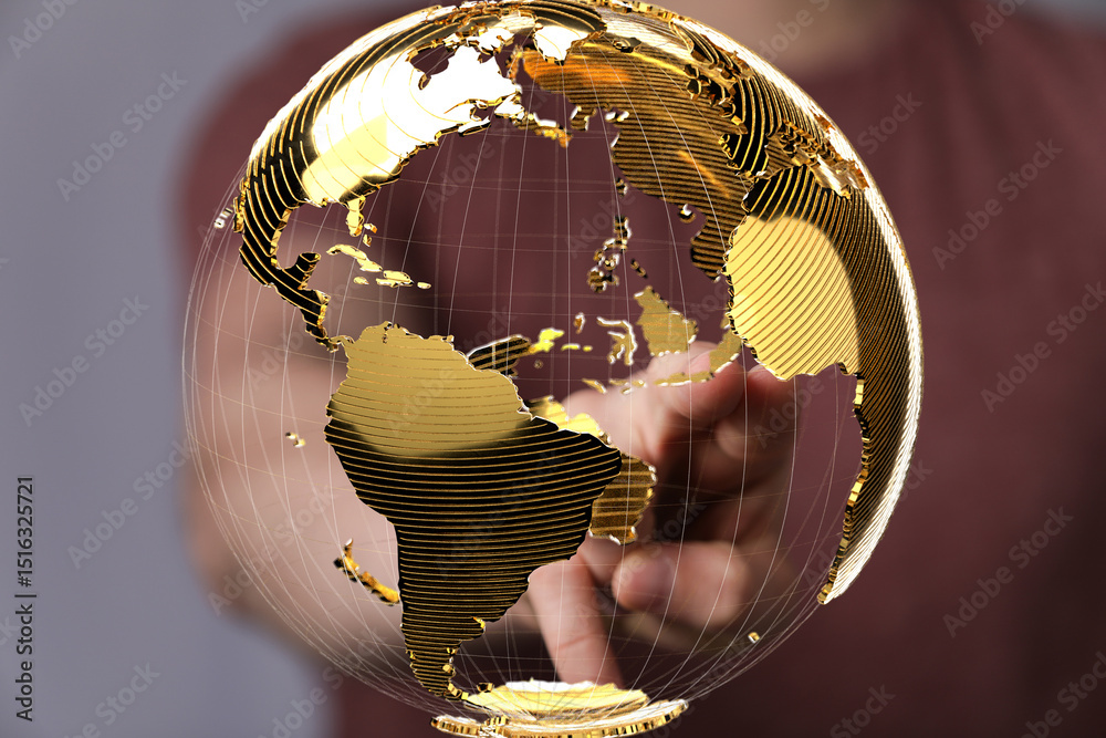 Fototapete abstract image of a hand interacting with a golden globe, symbolizing global connectivity and networ