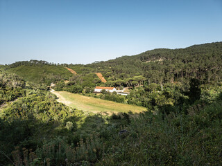Restored outbuildings and water cistern at urban farm in Portugal