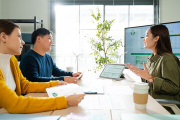 Young Asian business team discussion reusable product in office,start up eco-friendly business,environmental protection,sustainable business model,ESG strategy,team meeting,people work at home concept