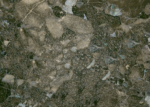 Abstract textured background resembling cracked stone or dried mud with intricate patterns