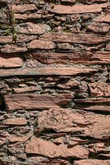 An old weathered red rock face closeup background
