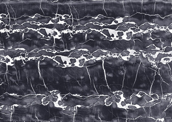 Dark gray marble showing white veins creating a natural pattern