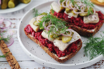 Scandinavian sandwiches with herring and beetroot