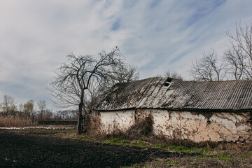 an abandoned building in a village among nature
