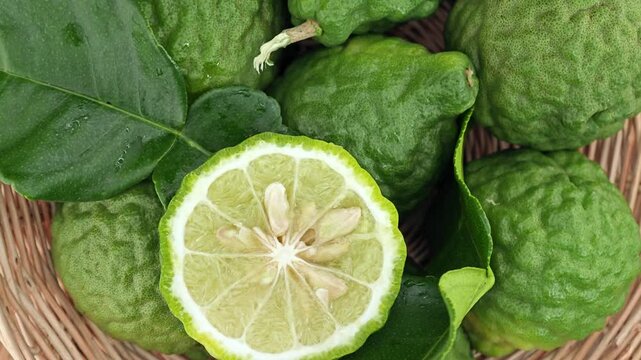Fresh Kaffir Lime Rotating on Wooden.