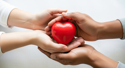 Gentle hands sharing a vibrant red heart symbolizing love care and compassion
