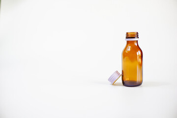 glass pill bottle isolated on white