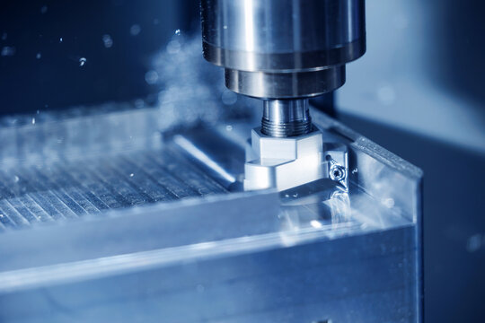 Precision cnc milling machine in operation, high-speed metal cutting process, blue color