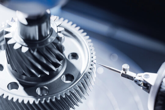 Cnc coordinate measuring machine analyzing metal gear with high precision in industrial setting
