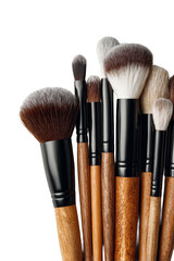 A collection of makeup brushes in different sizes and shapes on a black background.