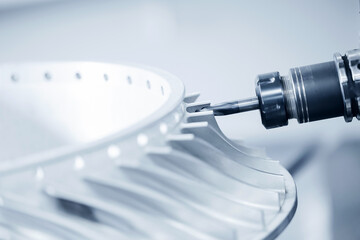 Precision cnc milling machine cutting metal turbine wheel close-up
