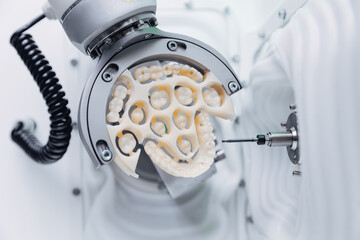 Cnc machine crafting dental veneers prosthesis with precision and detail