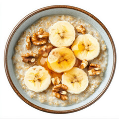 A breakfast bowl of warm oatmeal topped with banana slices, chopped walnuts, cinnamon, and a drizzle of honey.