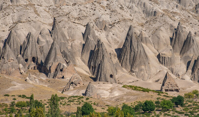Conical fairy chimneys, unique rock formations near Yaprakhisar in Ihlara valley, Cappadocia, Turkey..