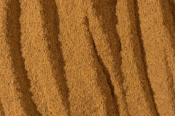 Fine Brown Ground Cinnamon. Culinary Background.