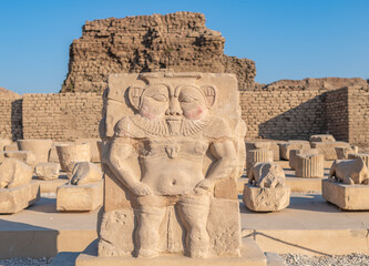 Statue of the ancient Egyptian god Bes, Hathor temple in Dendera, Egypt..