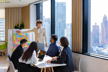 Manager is presenting new project to his team while having question from the panel in the executive meeting for next year plan with market share increase for global business and investment