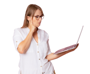 Image of young pensive woman standing isolated over transparent background using laptop computer. PNG transparent.