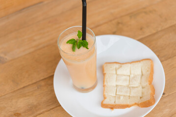 Milk melon Smoothie in glass with Roast bread