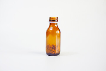 brown glass bottle for supplement product isolated on white background with clipping path